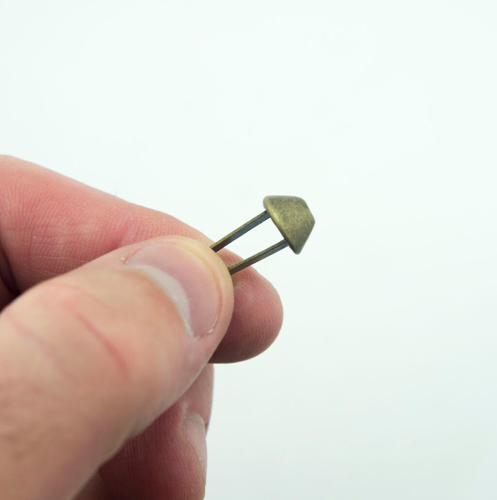 Close-up of a 10 mm dark bronze stud suitable for clothing and bags.
