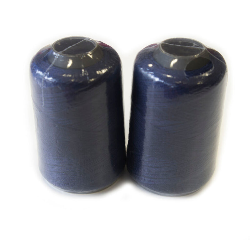 Two spools of mauve blue polyester sewing machine thread.