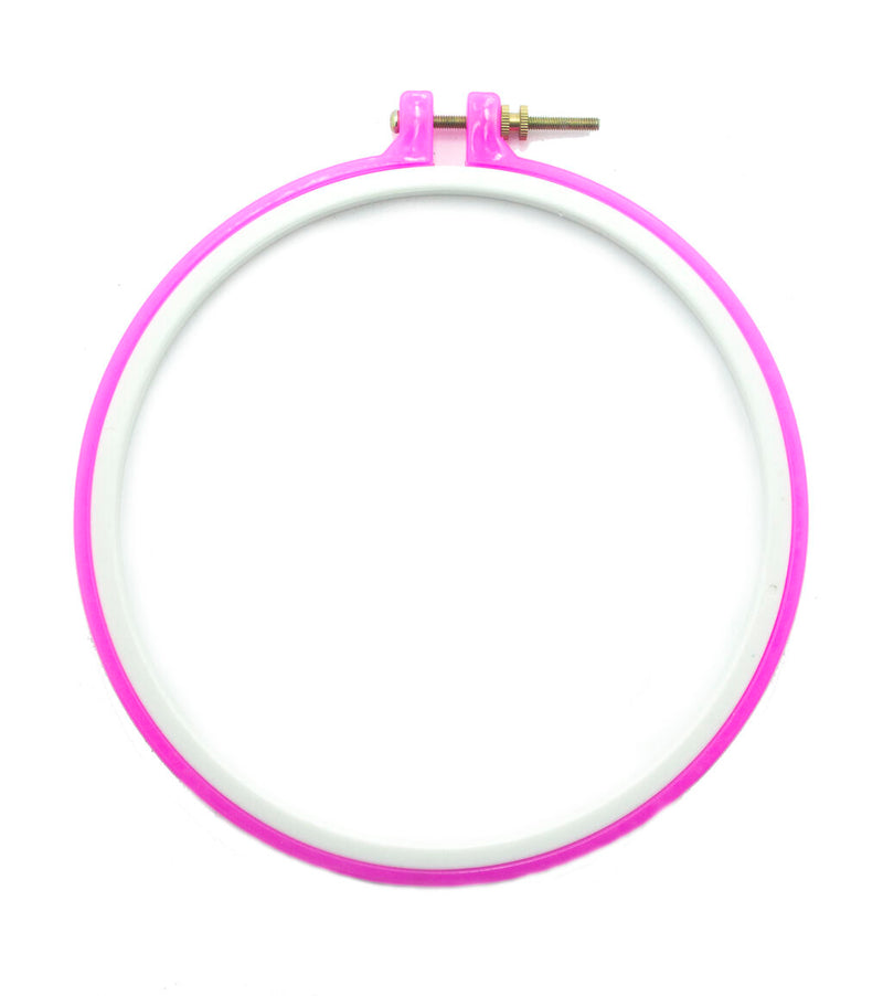 Pink plastic super grip embroidery hoop on a white background.