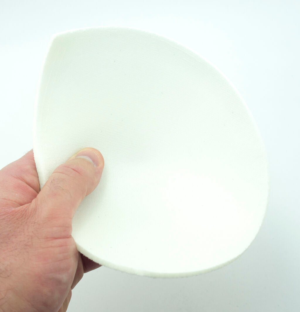 XL white bra pads laid flat to showcase size and shape.