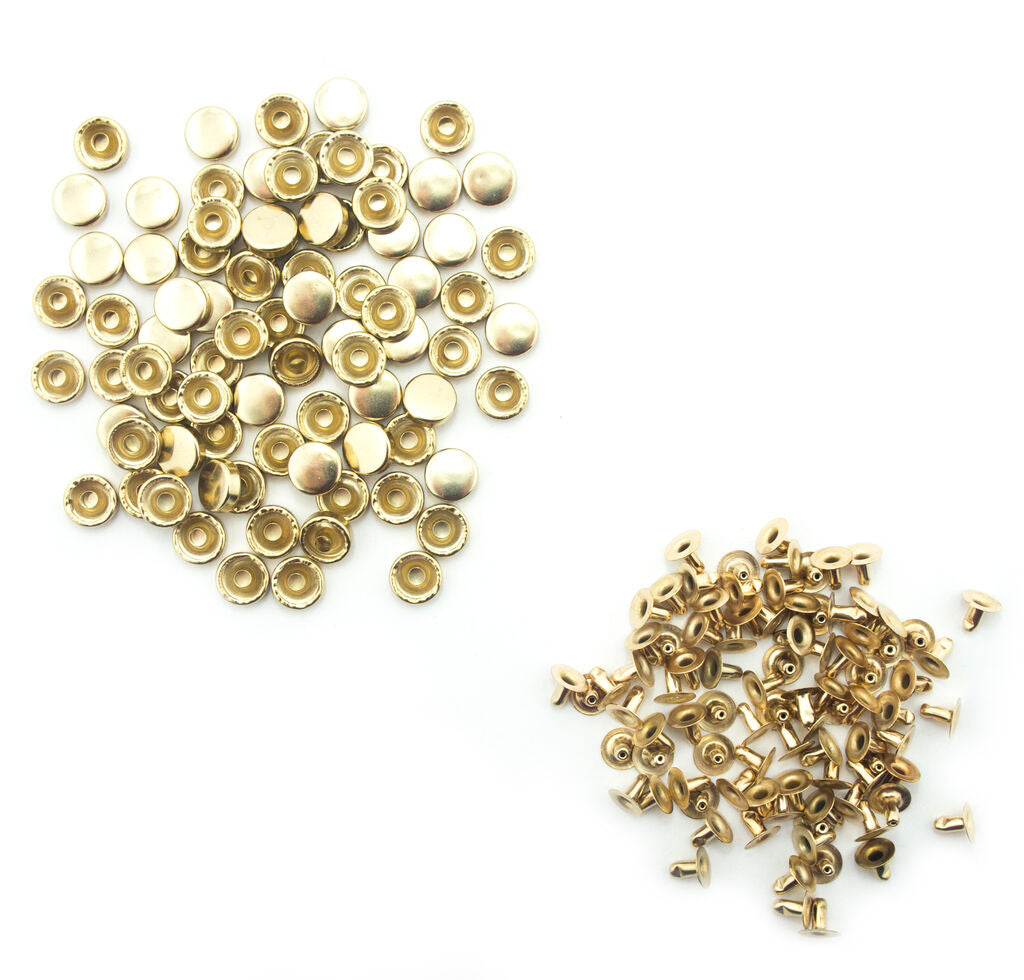 Pack of light brass tone chunky press studs on display