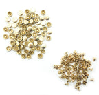 Pack of light brass tone chunky press studs on display