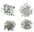Close-up of silver tone 4-part press stud buttons on a white background.