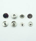 Pack of 20 silver tone press stud buttons displayed on a surface
