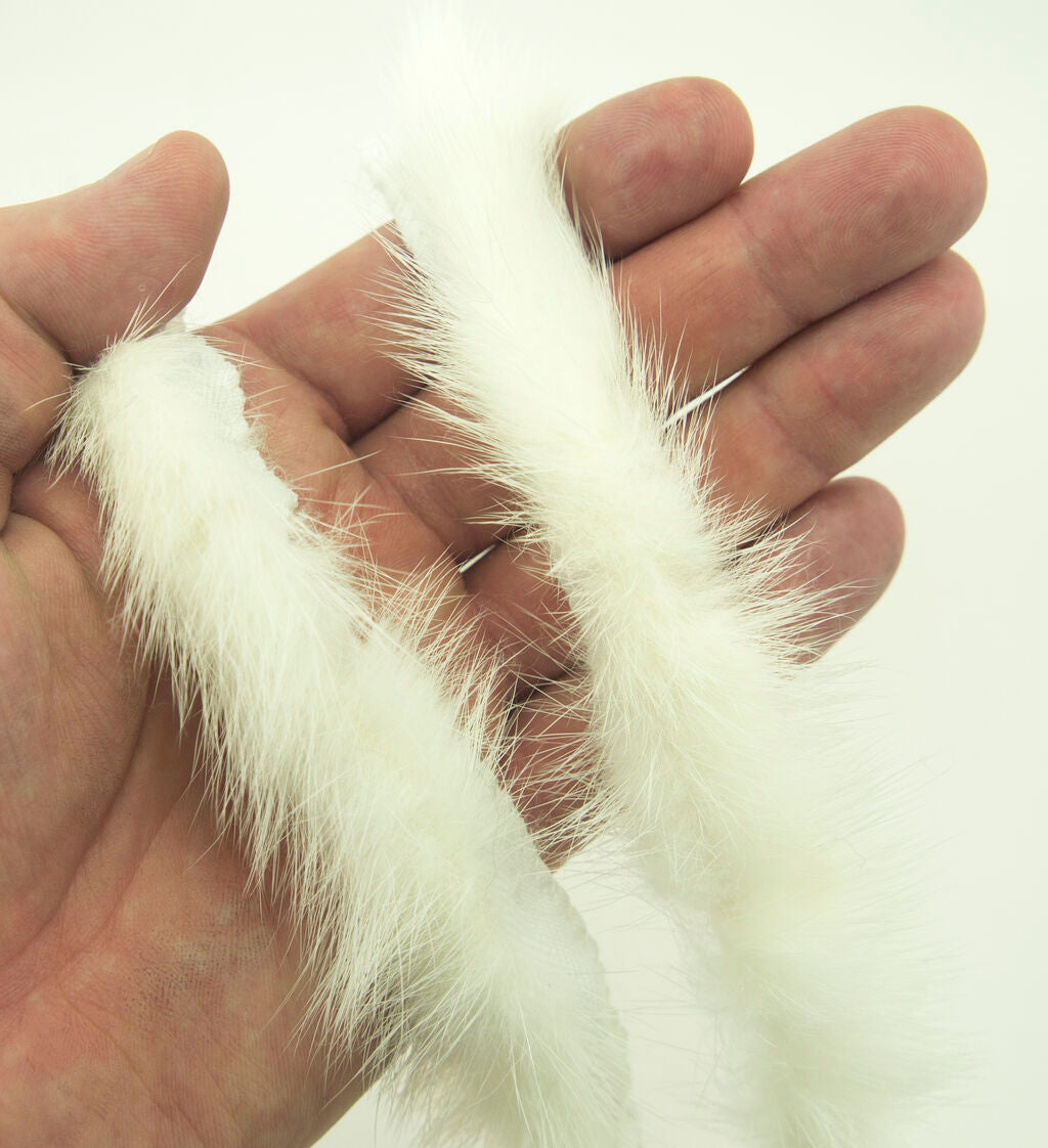Mink fur piping trim showcased with sewing tools