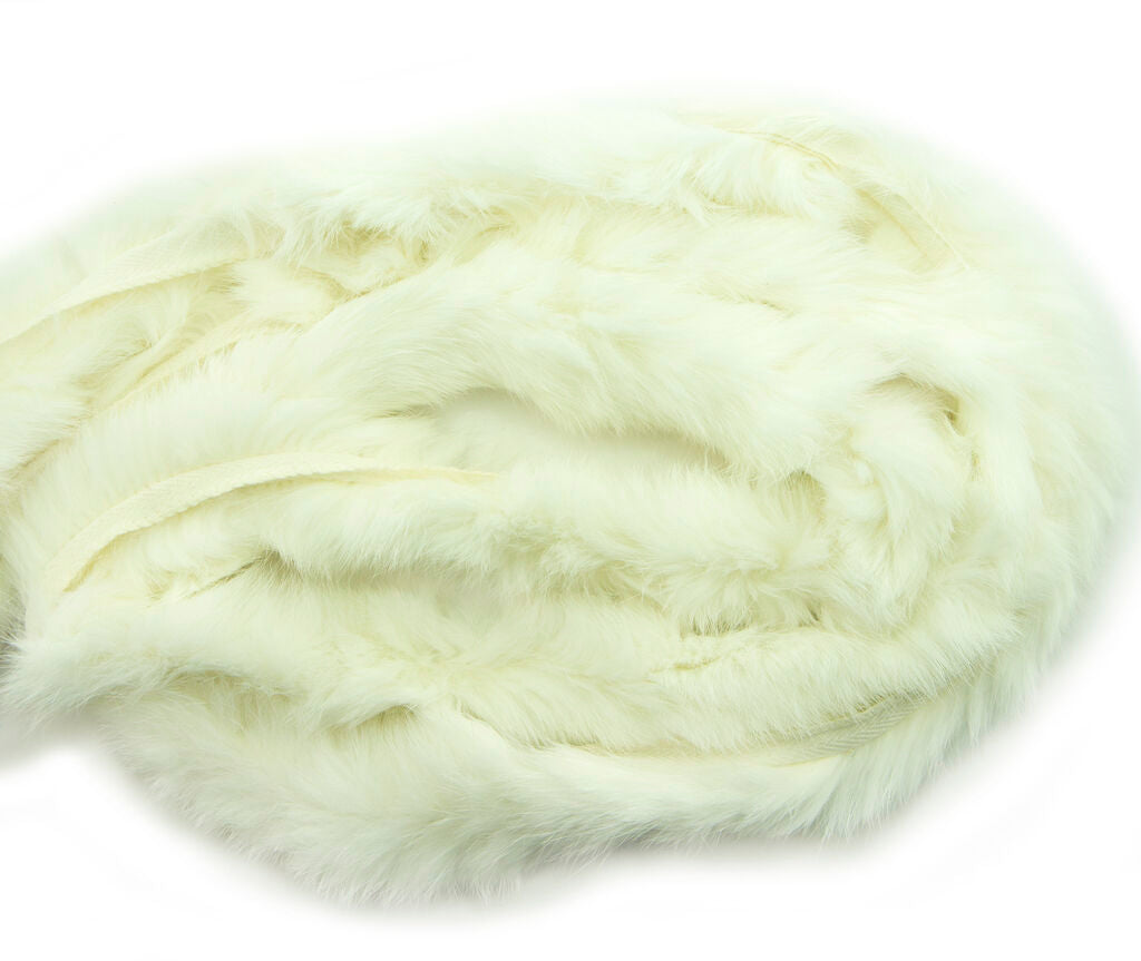 Close-up of white rabbit fur piping trim showing texture