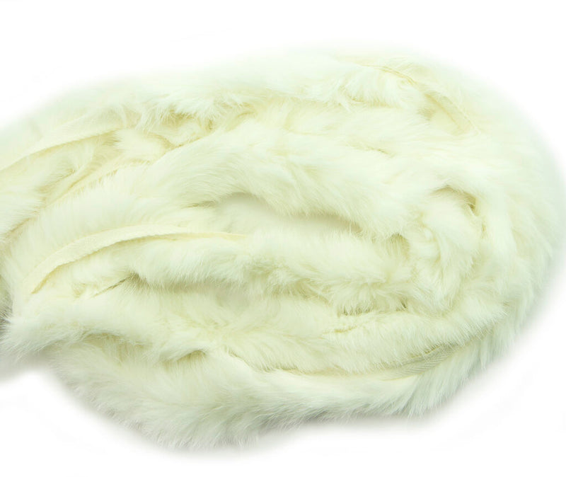 Close-up of white rabbit fur piping trim showing texture