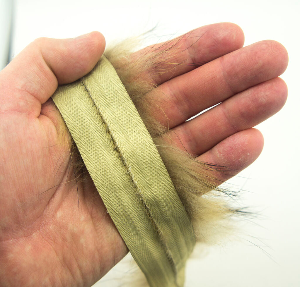 Close-up of the fluffy texture of the fox fur piping trim.