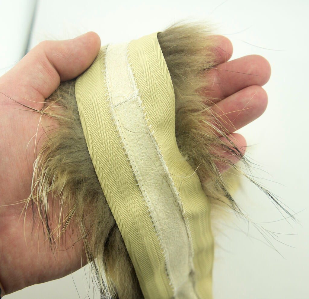 Close-up of the fluffy texture of the fox fur piping trim.
