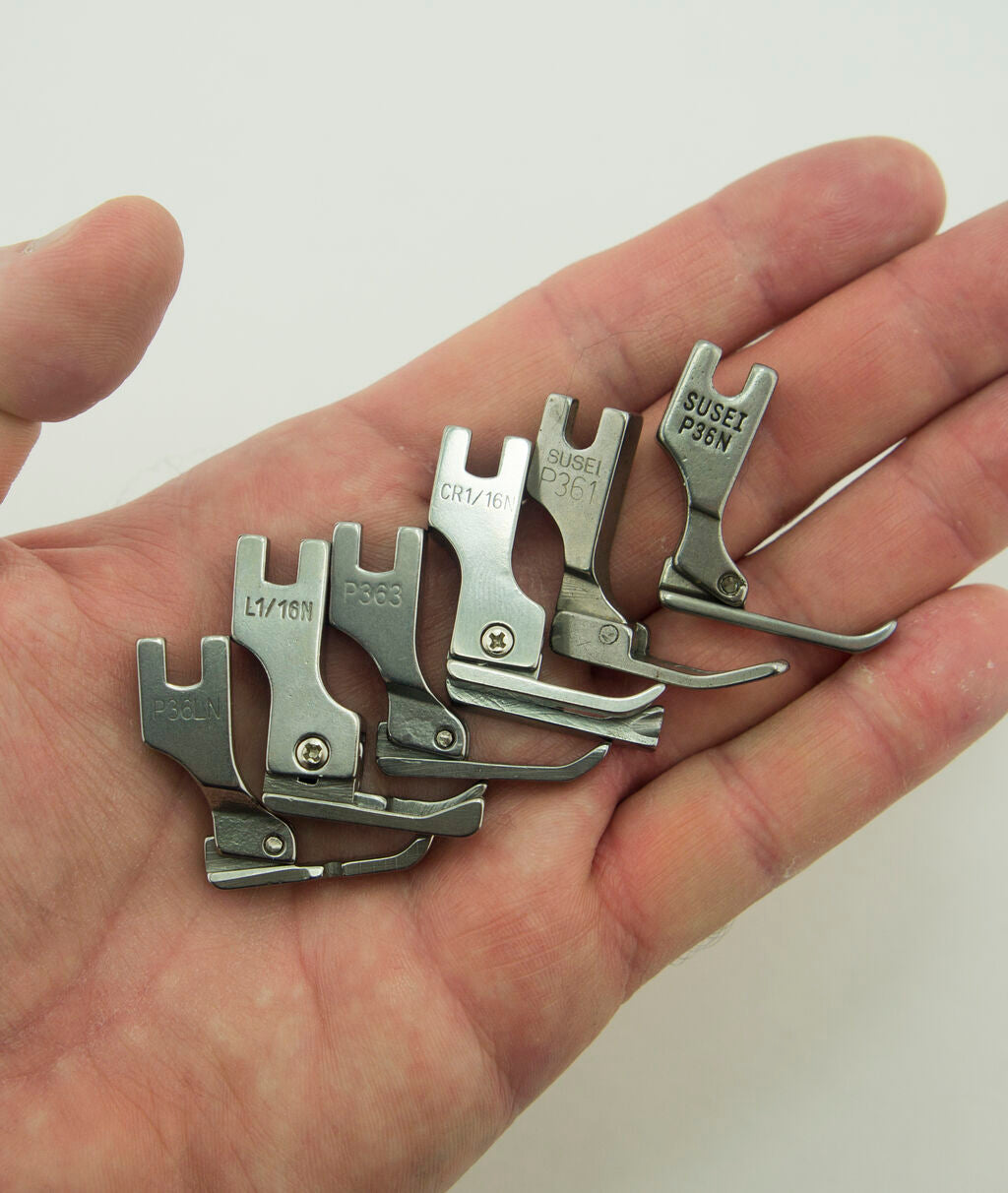 Student using industrial sewing machine feet for a project