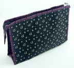 Open view of the pink make-up bag featuring a mirror attachment.