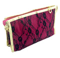 Deep pink pencil case with black lace and gold trim, zipped open
