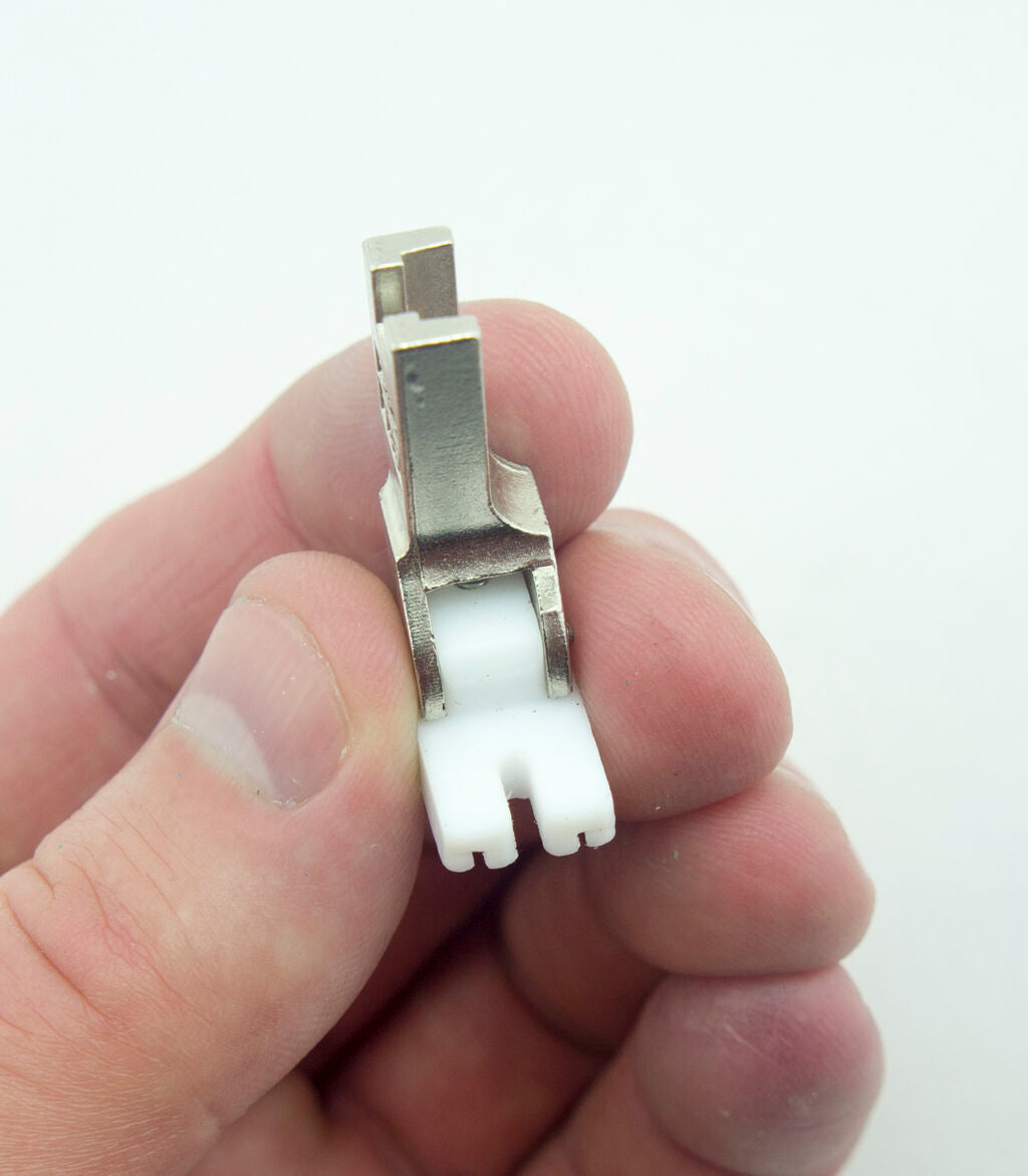 Close-up of T35 invisible zipper foot on a sewing machine