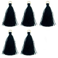 Five black silky tassels with antique brass rings displayed together.