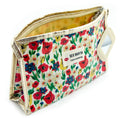 Cream flower field pencil case with gold edge and attached mirror.