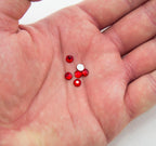 Close-up of 5 mm deep red rhinestones for embellishing fabrics