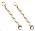 Two gold tone metal sew on coat hangers displayed together