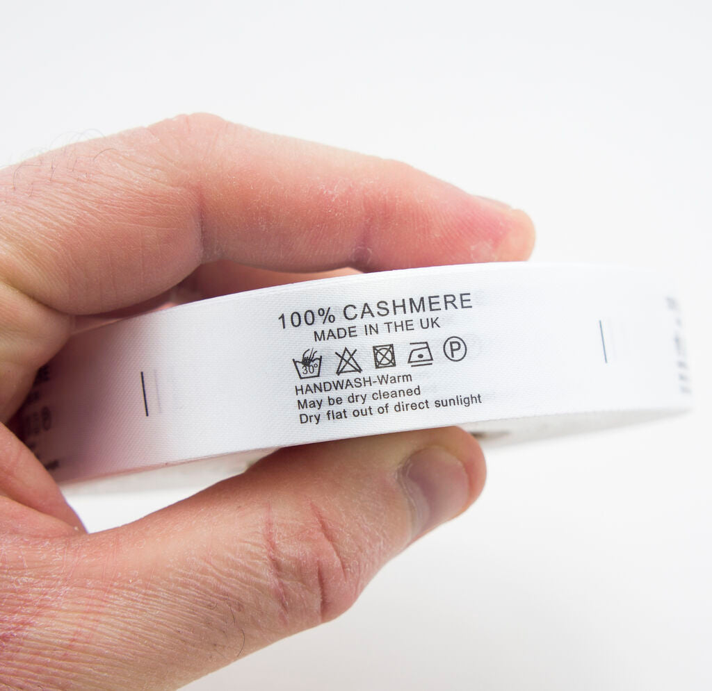 Close-up of wash care label showing 100% cashmere