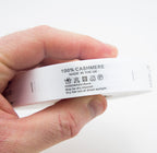 Close-up of wash care label showing 100% cashmere