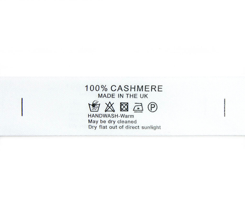 Roll of satin fabric printed wash care labels