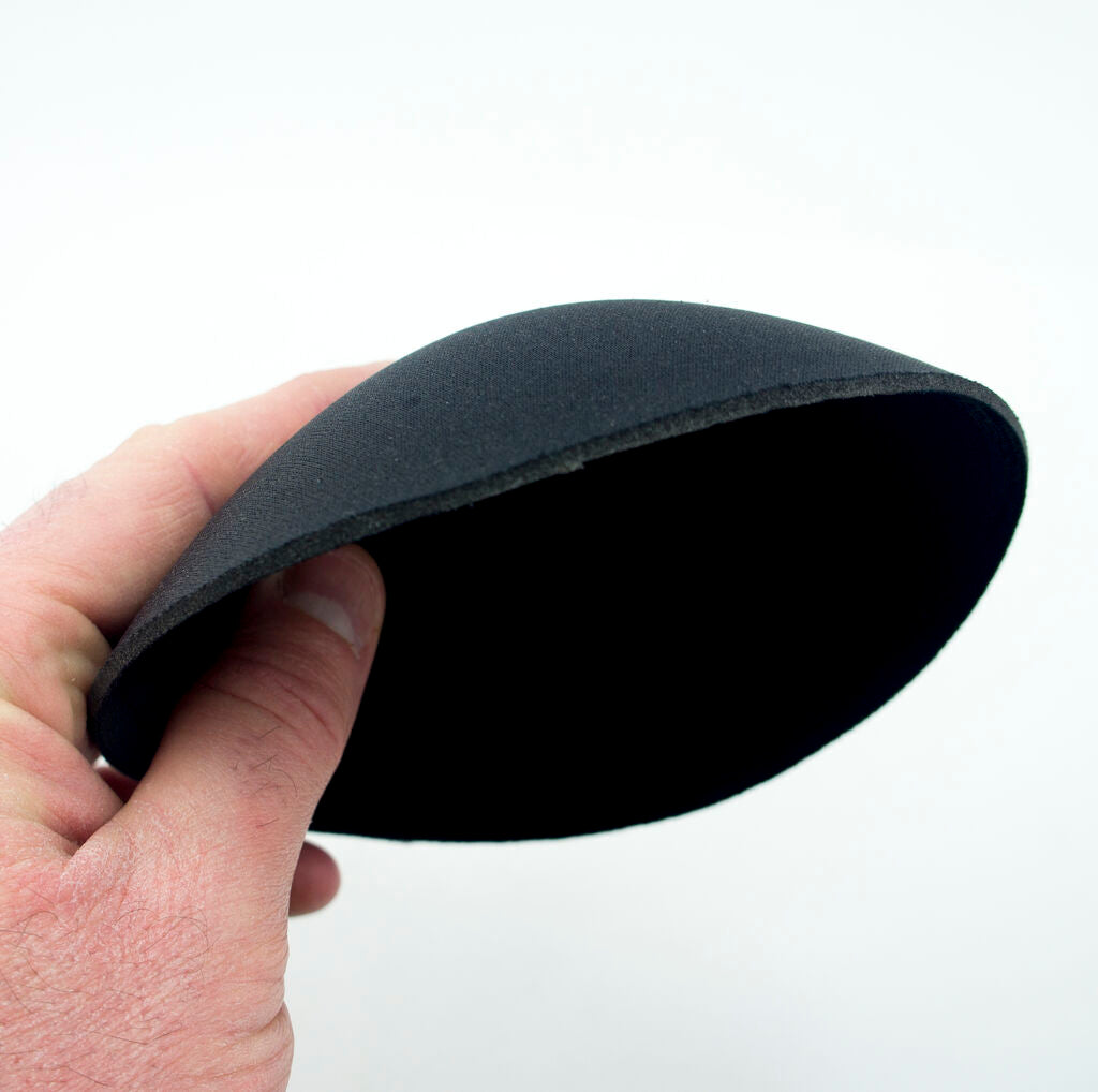 Close-up of soft and comfortable black bra pads for easy replacement.