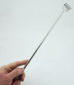 Compact telescopic steel backscratcher fitting into a pocket.