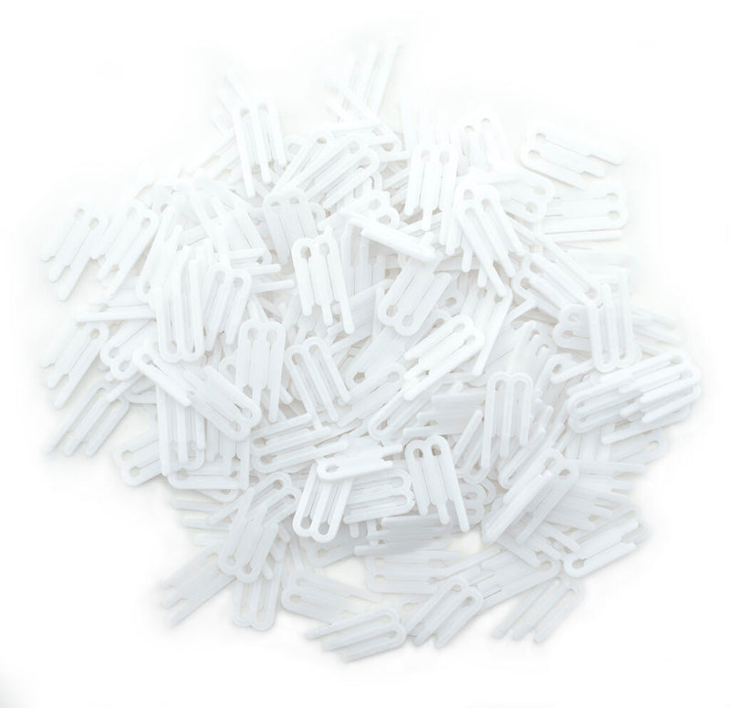 Pack of 500 white plastic 3 prong shirt clips on display.