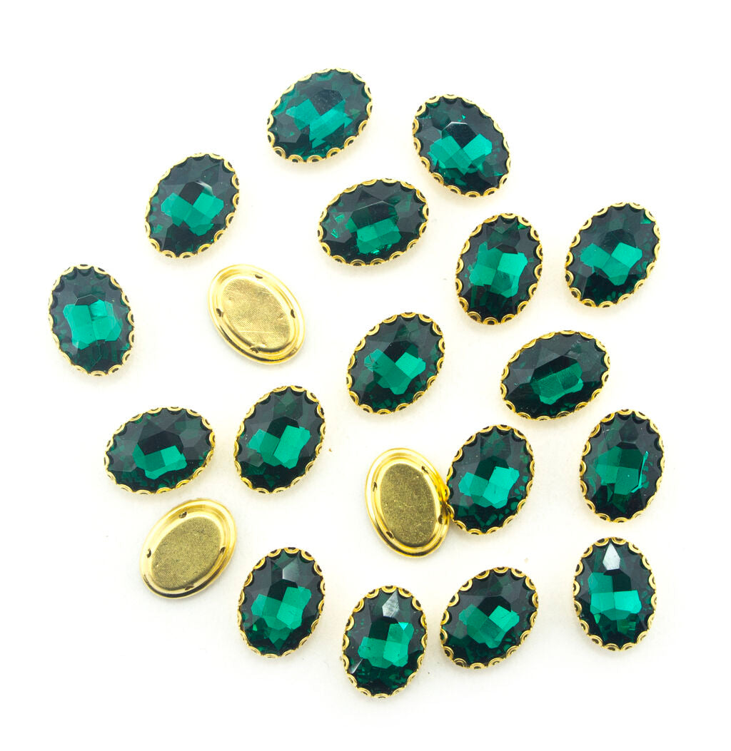 Gold tone peacock green crystal glass oval sew on embellishments in a pack of 20.