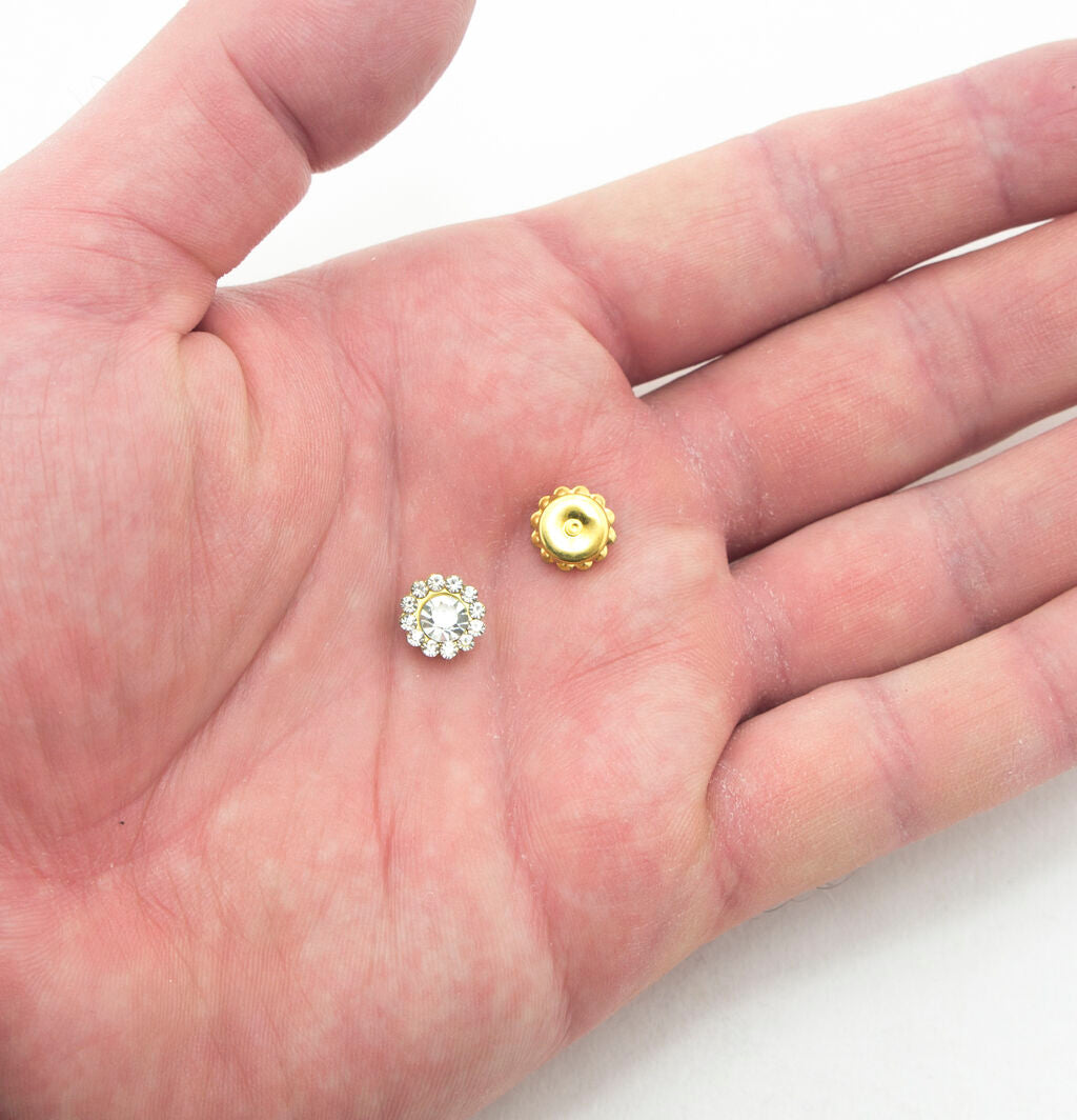 Close-up of a single round glass crystal sew on embellishment, 7.4 mm diameter.
