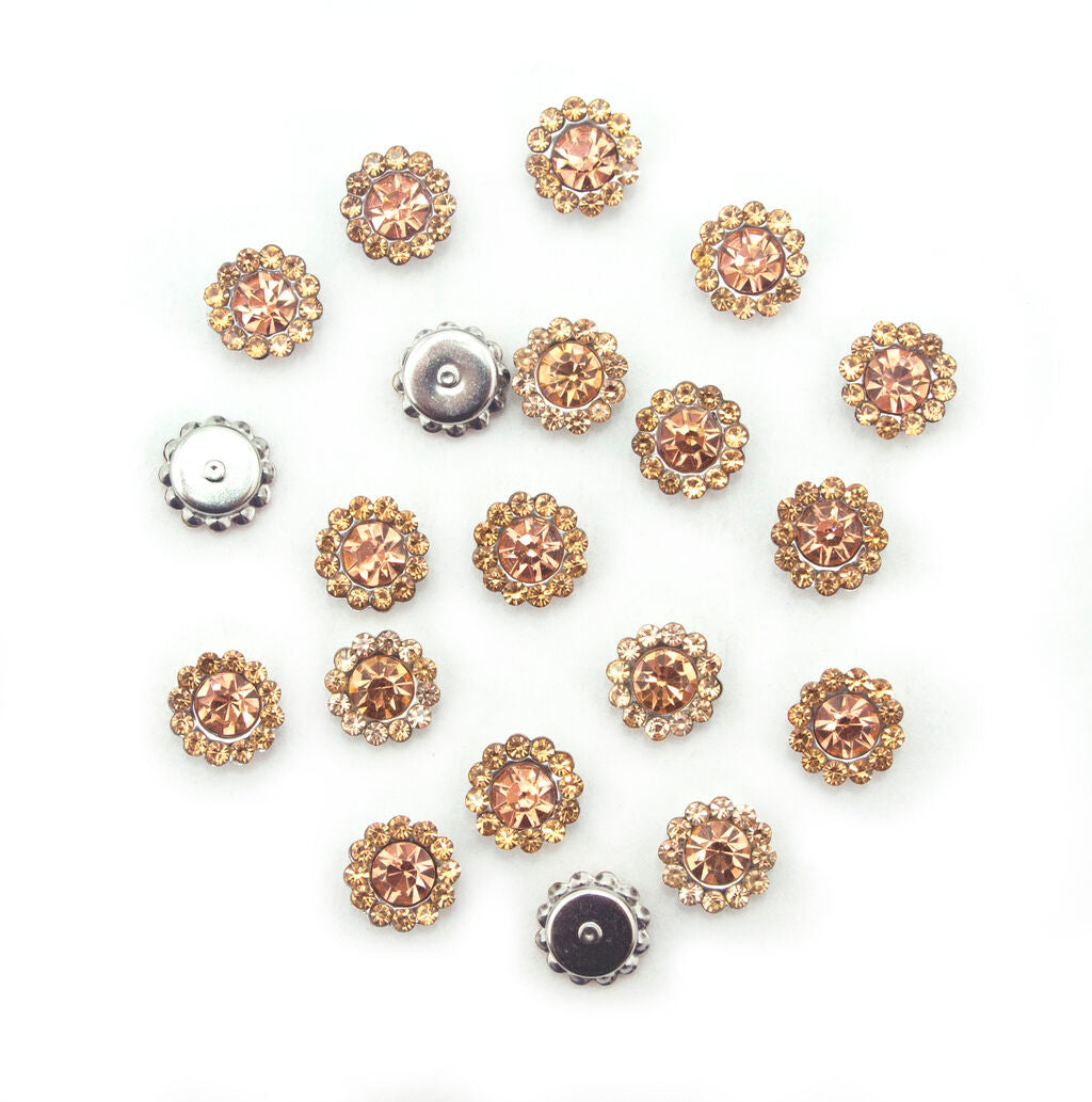 Pack of 20 small round golden champagne glass crystals in silver settings.