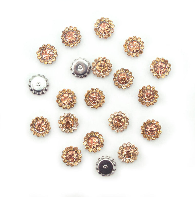 Pack of 20 small round golden champagne glass crystals in silver settings.