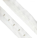 1 metre of white plush backed polyester/nylon bra hook and eye tape
