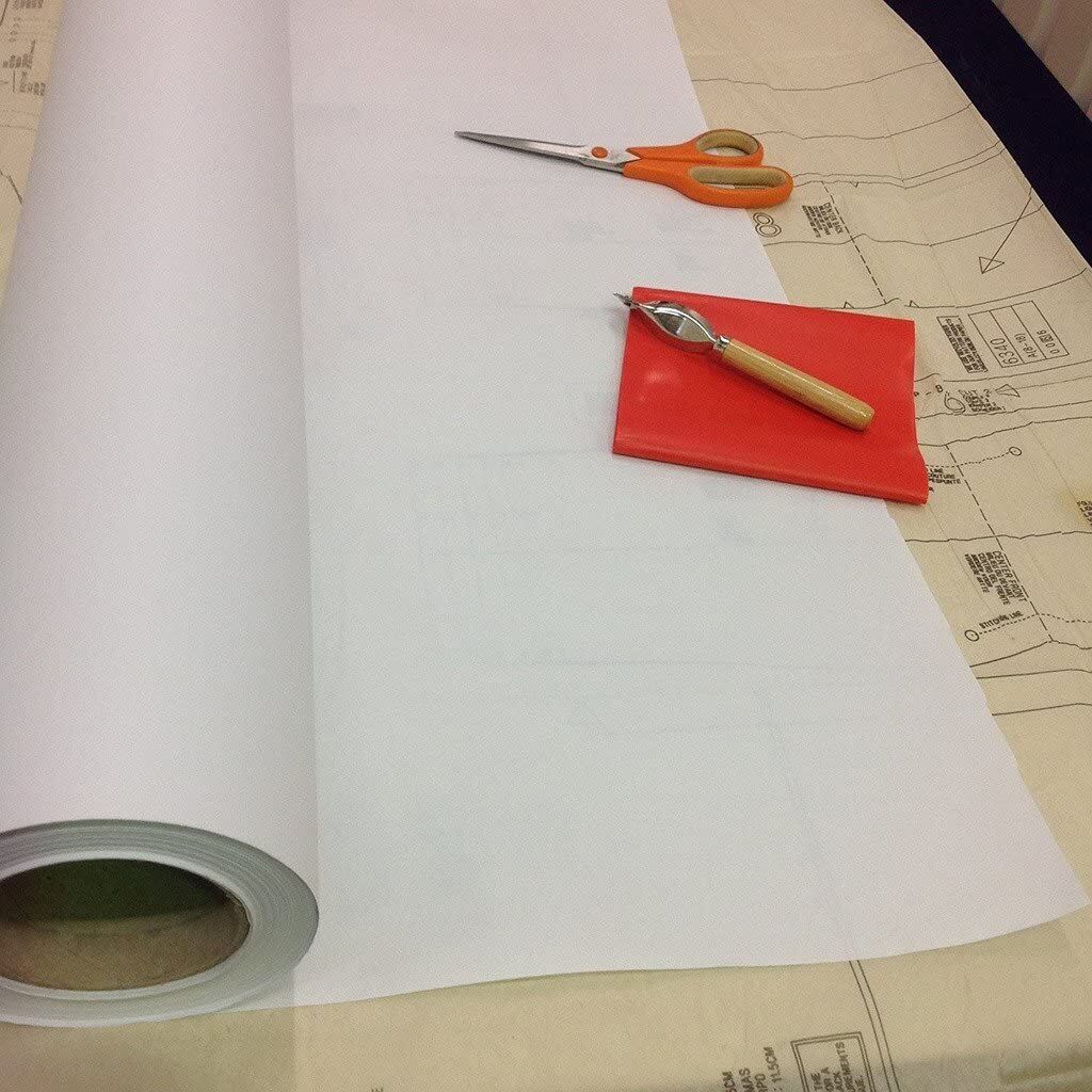 Close-up of adhesive side of tracing paper for pattern cutting