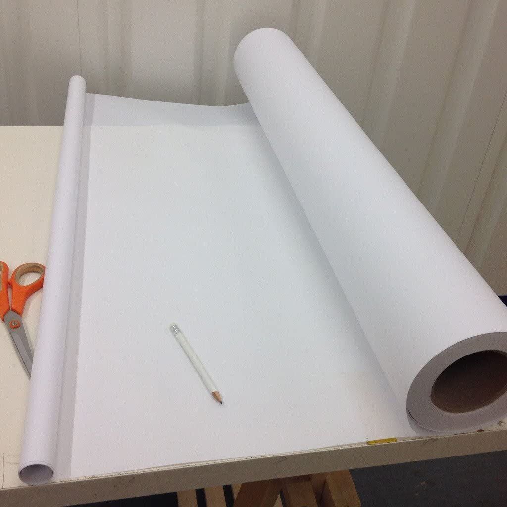 Measuring the width of white tracing paper for fashion design