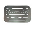 Metal credit card size drawing shapes template stencil on a flat surface.