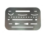 Metal credit card size drawing shapes template stencil on a flat surface.