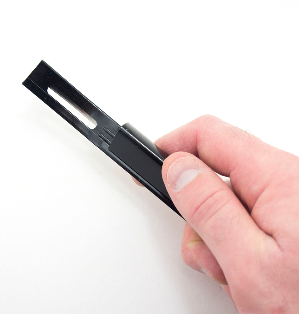 Close-up of the leathercraft tool demonstrating the beveller feature