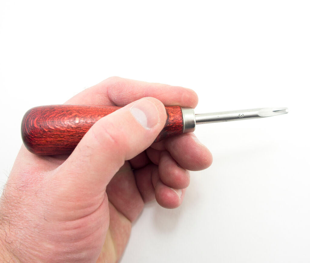 Various angles of the leather beveling tool displayed