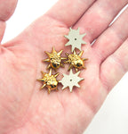 Display of light gold tone skull and star embellishments