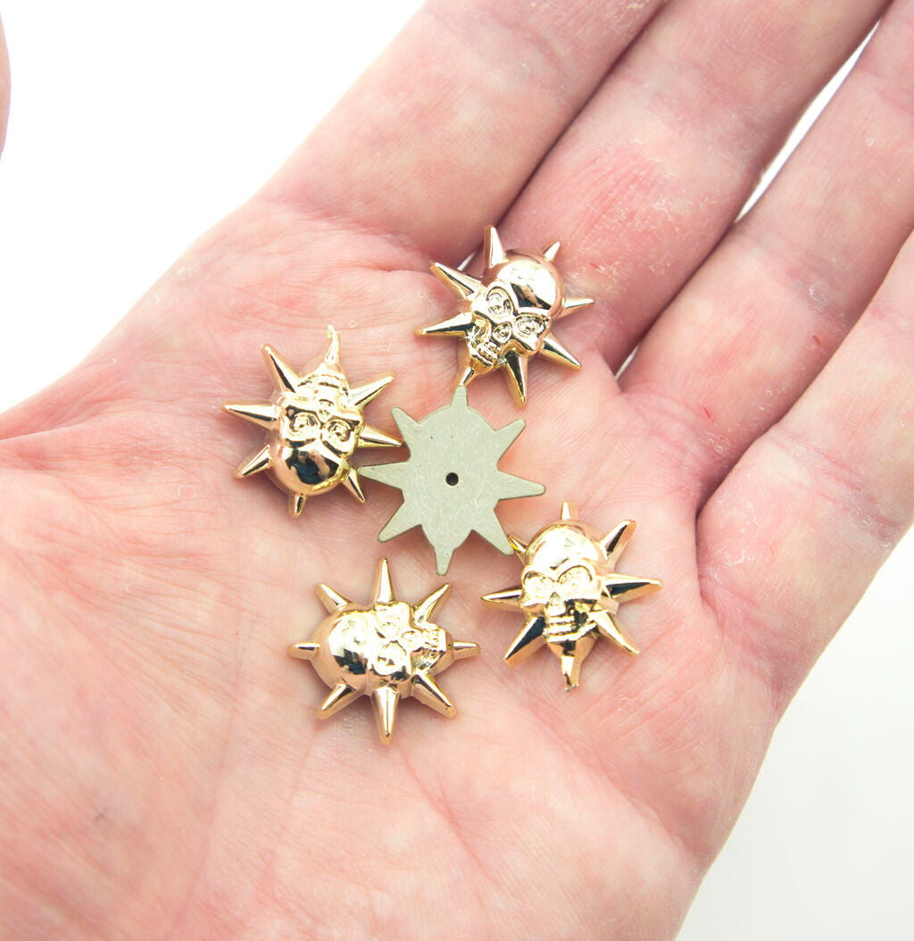 Light gold tone star embellishment with pin fix backing