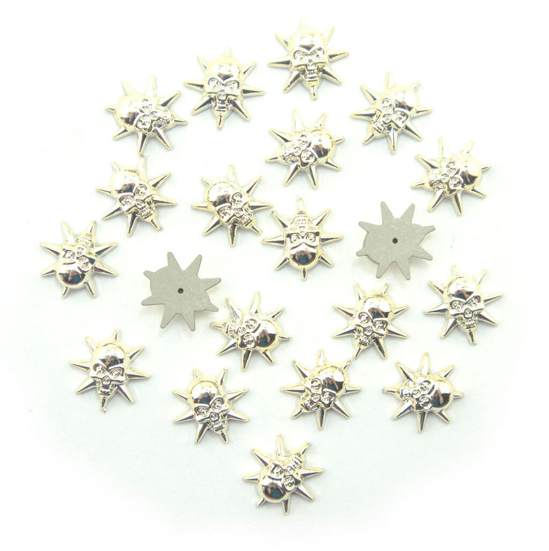 Set of 20 light gold tone star skull embellishments