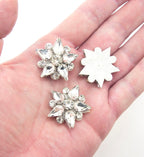Pack of ten 30 mm diameter crystal glass star embellishments.
