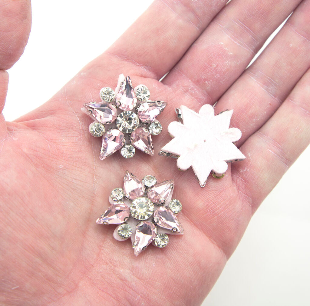 Close-up of pink felt backing on crystal glass star embellishments.