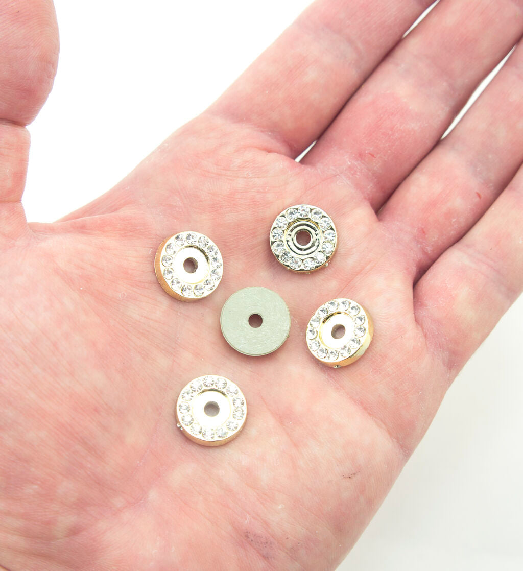 Embellishments arranged on a crafting table for projects
