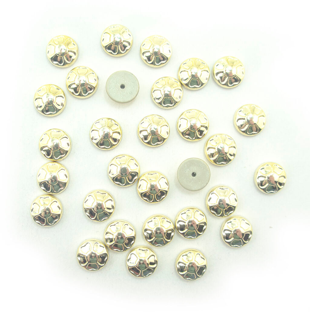 Clover gold tone trims displayed on a white background