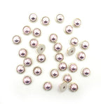 Pack of 30 round rose and gold tone trims, 11mm diameter.