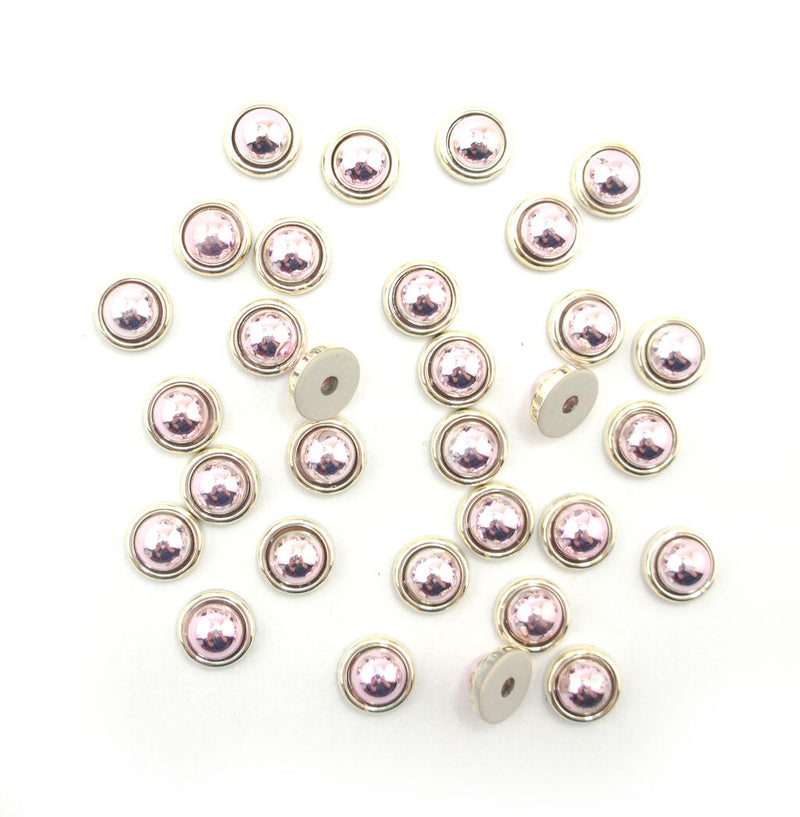 Pack of 30 round rose and gold tone trims, 11mm diameter.
