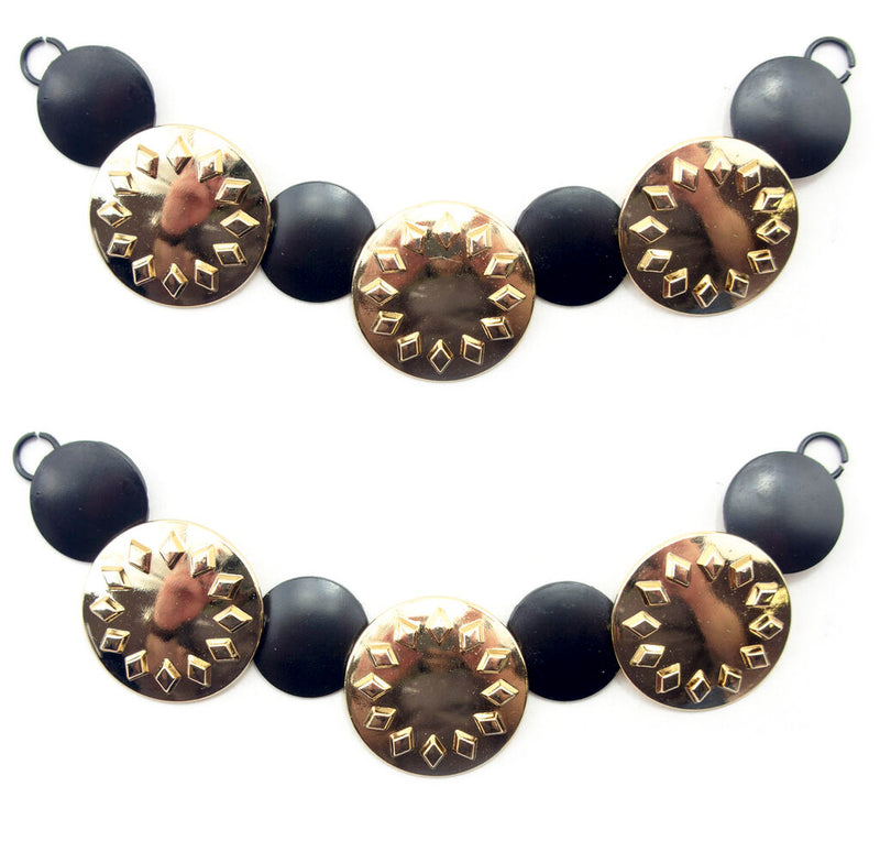 Gold tone and black circular discs pendant chain displayed on a white background.