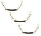 Set of 3 gold tone metal sew on coat hangers displayed.