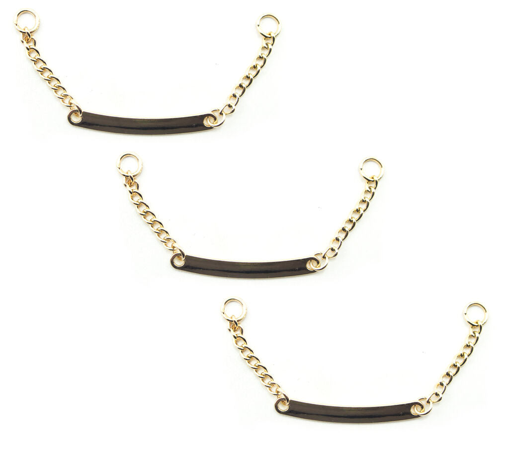 Set of 3 gold tone metal sew on coat hangers displayed.